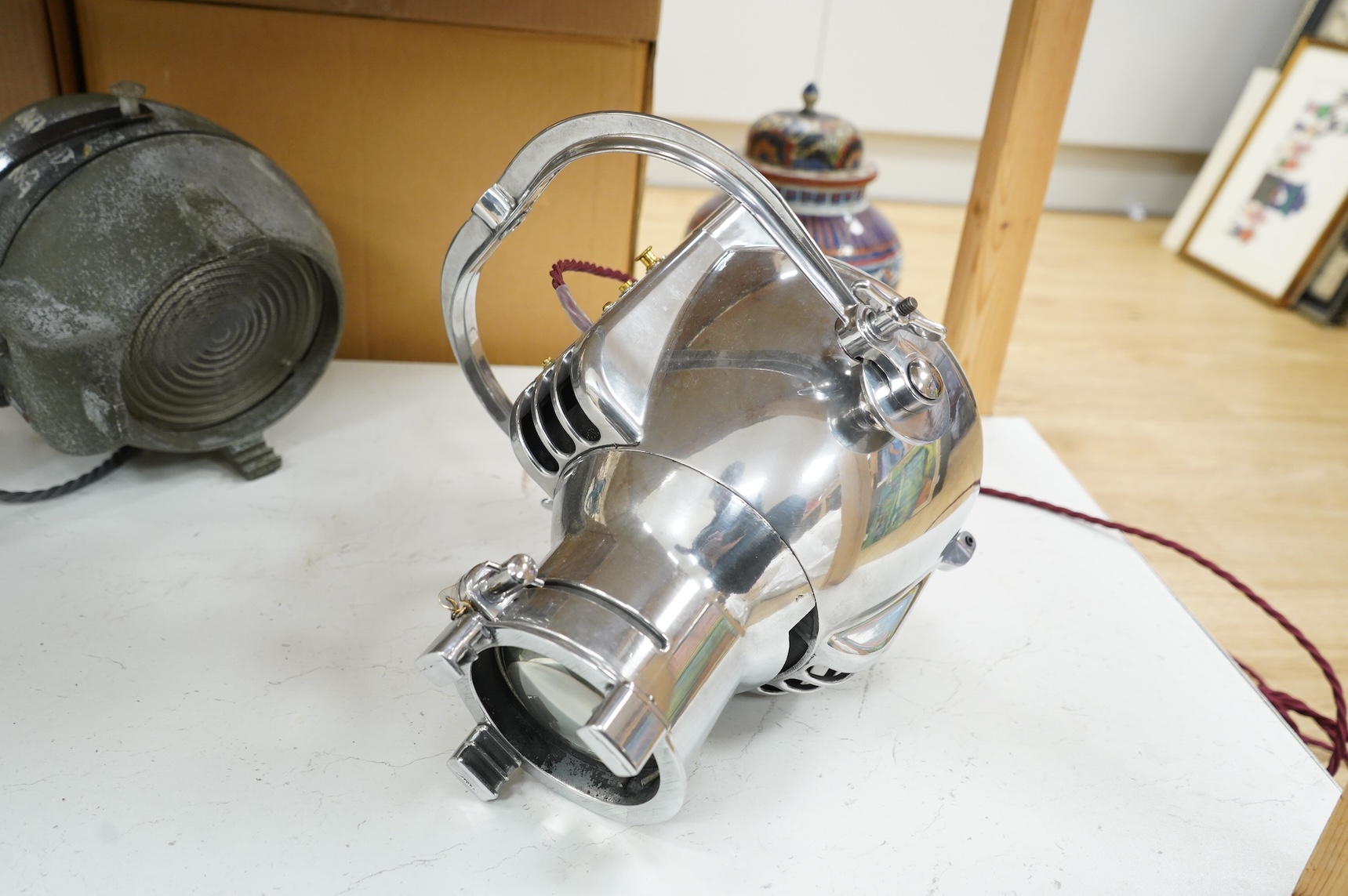 A vintage Strand electric chrome theatre lamp